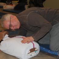Man learns to perform CPR on test dummy